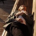 man laying on bench
