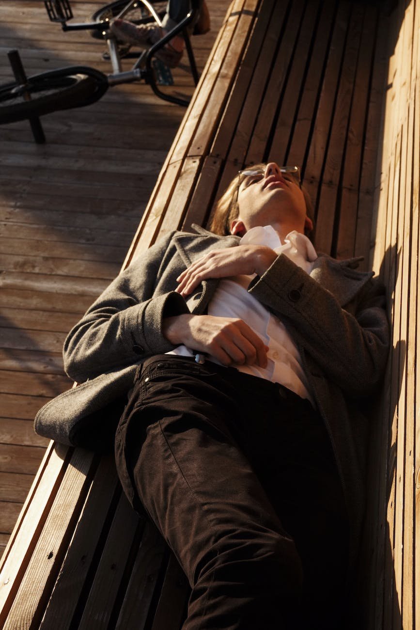 man laying on bench