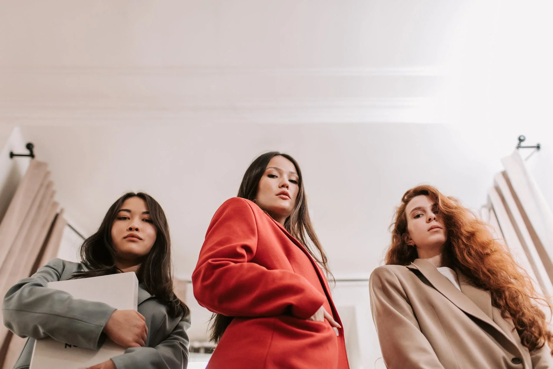 low angle shot of women wearing blazer while posing at the camera