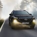 black hyundai vehicle on road